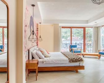 Selina Baños - Baños de Agua Santa - Habitación